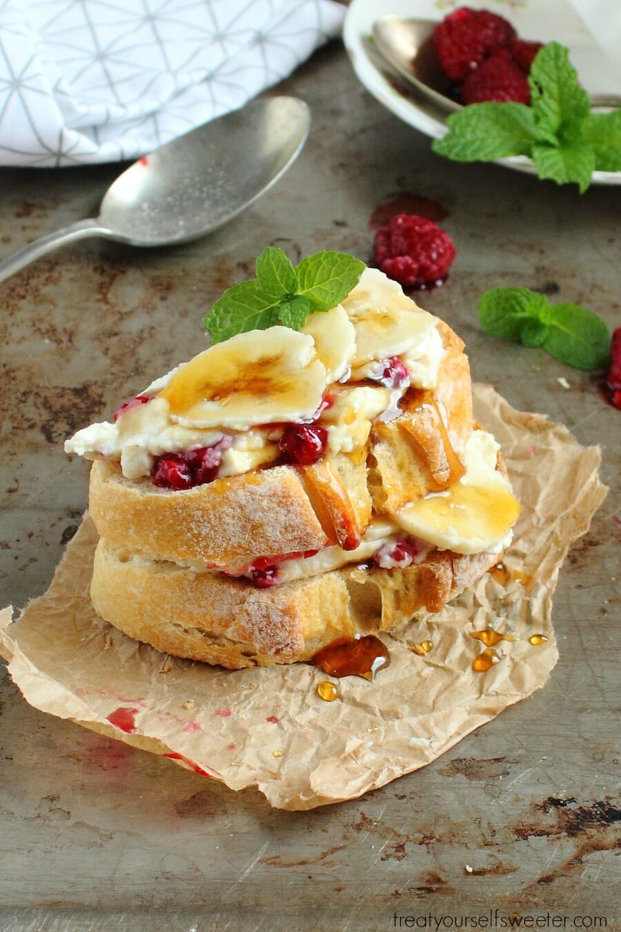 Honey Ricotta Toast with Raspberries and Banana; crunchy toast smothered with creamy, sweet honey ricotta, raspberries and banana. Quick, easy & perfect for brunch!